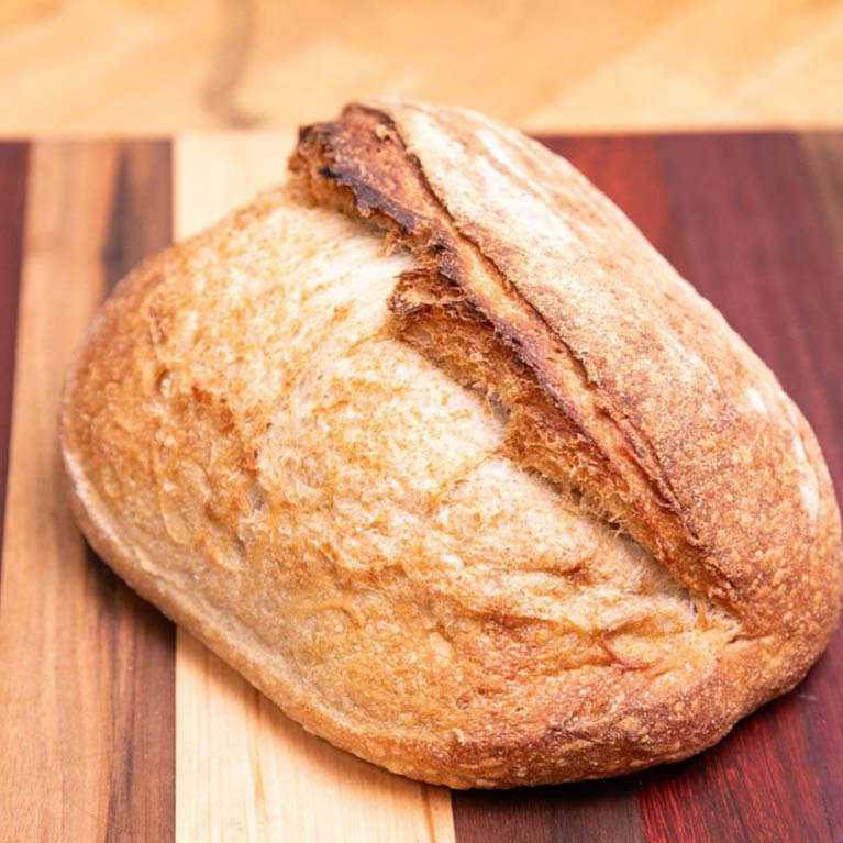 Freshly baked crusty sourdough bread loaf