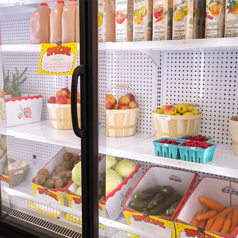 Refrigerated produce and juice display in grocery store