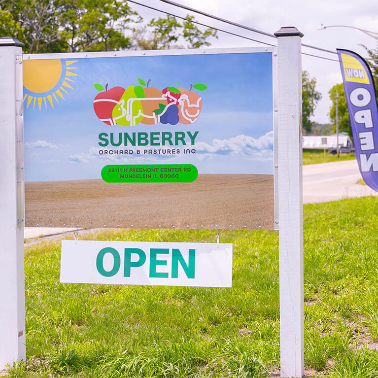 Sunberry Orchard and Pastures open sign outdoors