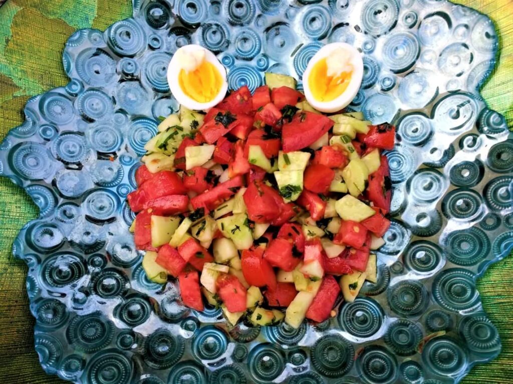 Fresh cucumber tomato salad with boiled eggs